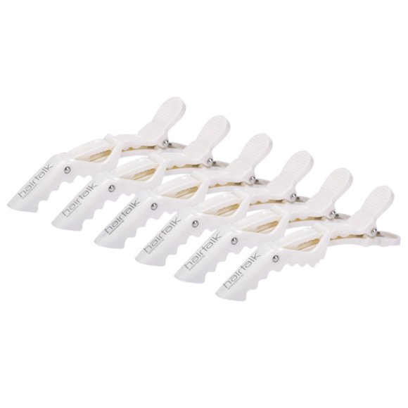 Zes witte Heatreak-haarclips met geribbelde handgrepen, netjes gerangschikt op een witte achtergrond, in navolging van het veerkrachtige ontwerp van hairtalk® Alligator Clips, perfect voor het vastzetten van hairextensions.